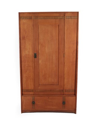 Lot 2095 - An Arts & Crafts Oak Wardrobe, with ebony stringing, the single door above a drawer, 107.5cm...