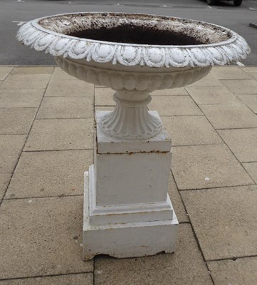 Lot 1100 - A large Victorian white painted cast iron garden urn decorated with egg and dart borders and raised