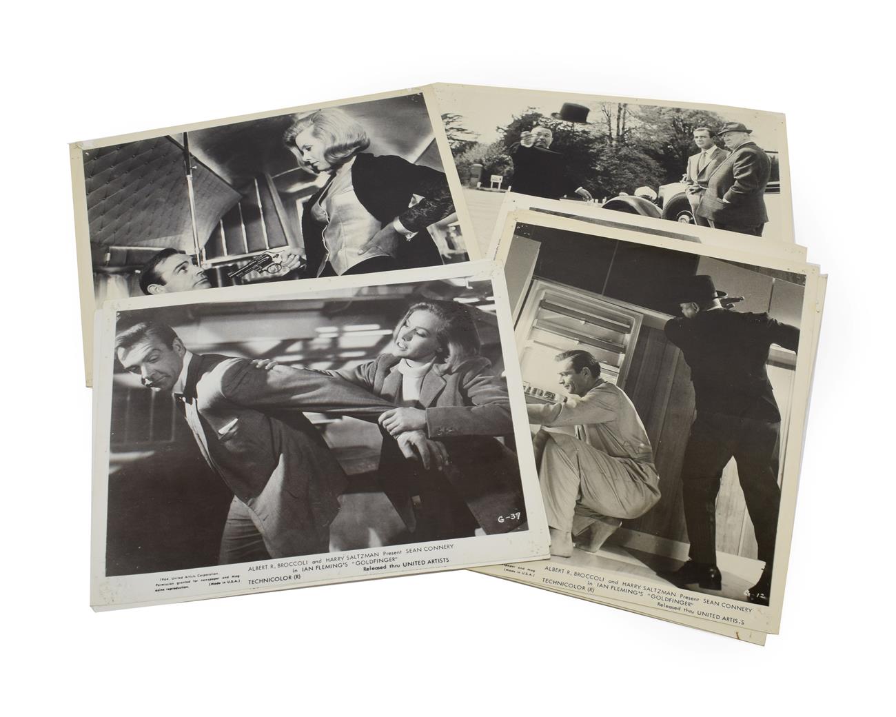 Lot 3020 - James Bond 007 Goldfinger Black And White Lobby Cards a collection of 24 each embossed with...