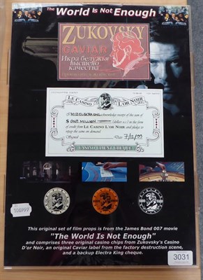Lot 3031 - James Bond 007 The World Is Not Enough Original Film Props a framed set consisting of three...