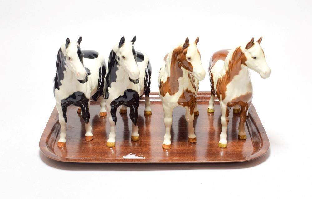 Lot 224 - Beswick Horses Comprising: Pinto Pony, model No. 1373, second version, two piebald and two skewbald
