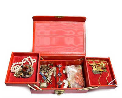 Lot 500 - A red jewellery box containing miscellaneous jewellery including a Scottish paste set Celtic brooch