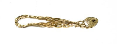 Lot 536 - A fancy link bracelet with a 9 carat gold heart shaped padlock, length 19cm