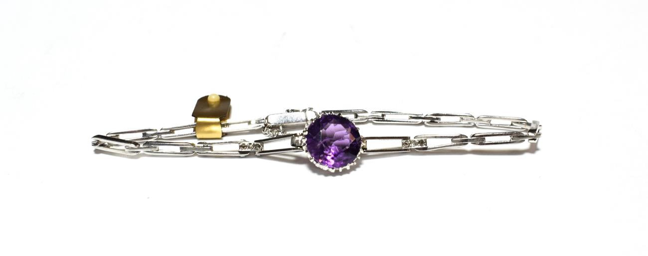 Lot 538 - An amethyst and diamond bracelet, a round cut amethyst in a white claw setting, to tapering...