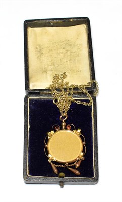Lot 539 - An Edwardian garnet locket on a 9 carat gold chain, drop length 5.8cm, chain length 51.5cm