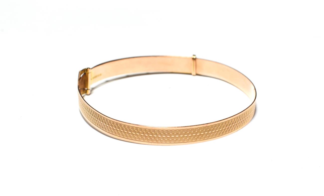 Lot 540 - A 9 carat gold belt and buckle bangle