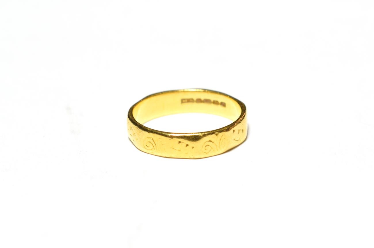 Lot 542 - A 22 carat gold textured band ring, finger size H