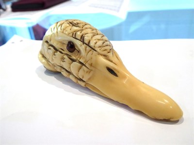 Lot 557 - A 19th century carved ivory Ducks head form cane handle, a Chinese Ivory page turner of similar...