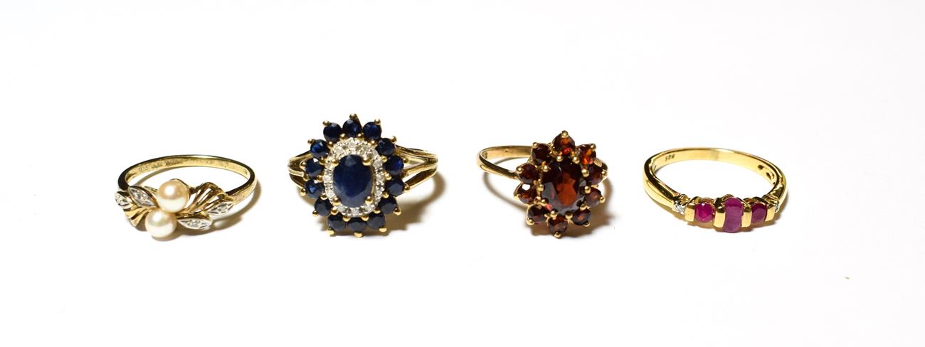Lot 563 - A sapphire and diamond cluster ring, stamped '9K', finger size P; a 9 carat gold garnet cluster...