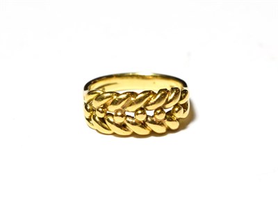 Lot 579 - An 18 carat gold rope ring, finger size P