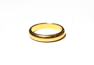 Lot 583 - A 22 carat gold band ring, finger size Q