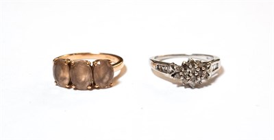 Lot 585 - A 9 carat gold diamond cluster ring, finger size N; and a 9 carat gold smokey quartz three...