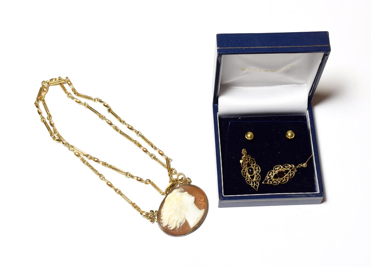 Lot 587 - A pair of 9 carat gold garnet drop earrings, length 3.0cm; a pair of stud earrings, stamped...