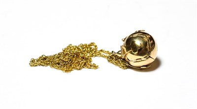 Lot 590 - A Masonic ball pendant stamped '9CT/SIL' on a ropetwist chain, length 50.5cm