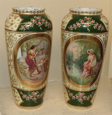 Lot 646 - A pair of Vienna porcelain vases, hand painted with floral designs and vignettes with figures