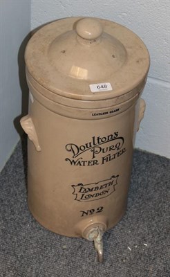 Lot 648 - A Doulton Lambeth Stoneware Puro water filter, with cover and tap fitting