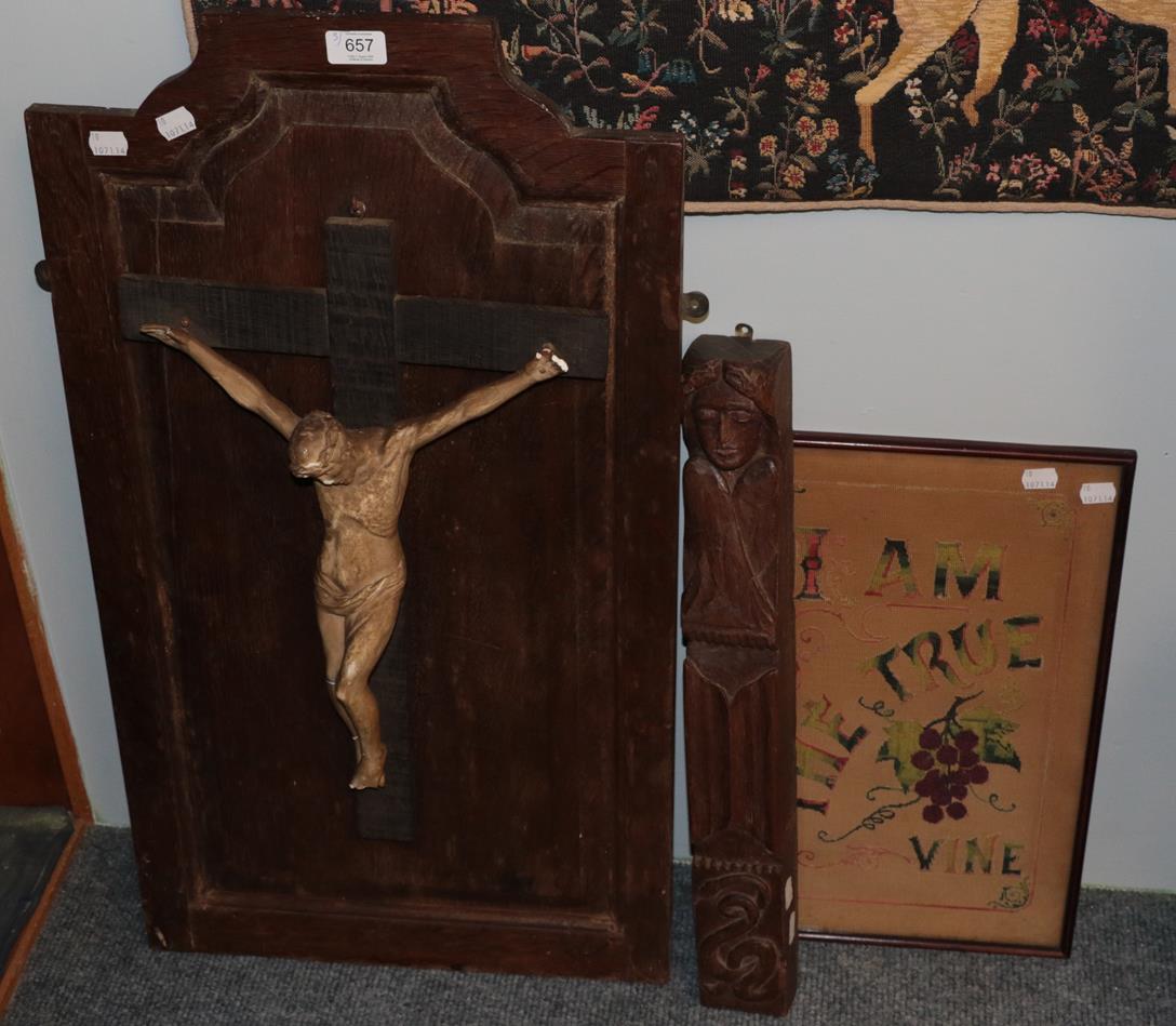 Lot 657 - Carved furniture mount, a crucifix, and needlework (3)