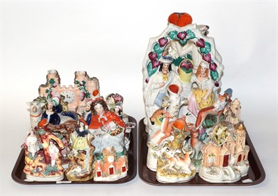 Lot 691 - Two trays of 19th century Staffordshire flat back figures, spill vases and a pocket watch stand