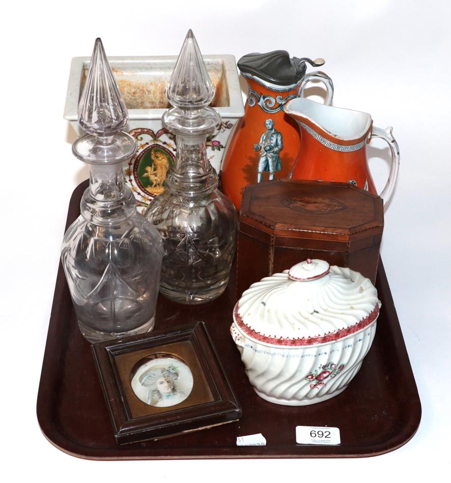 Lot 692 - A George III inlaid mahogany tea caddy, porcelain caddy of similar date, two Wedgwood jugs,...