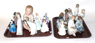 Lot 693 - Two trays of figures comprising Coalport, four Royal Doulton, two Lladro, nine Nao, together with a