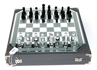 Lot 701 - A silver crystal Swarovski chess set, boxed