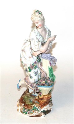 Lot 726 - A Derby porcelain figure of a girl and flowers