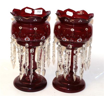 Lot 753 - A pair of ruby glass table lustres, circa 1890, with castellated rim, painted foliate bands and...