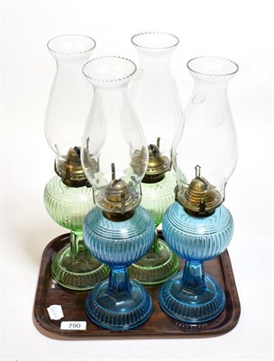 Lot 790 - Two pairs of coloured glass oil lamps