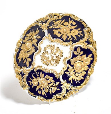 Lot 806 - A Meissen gilt-highlighted cobalt blue dish, decorated with flowers in relief