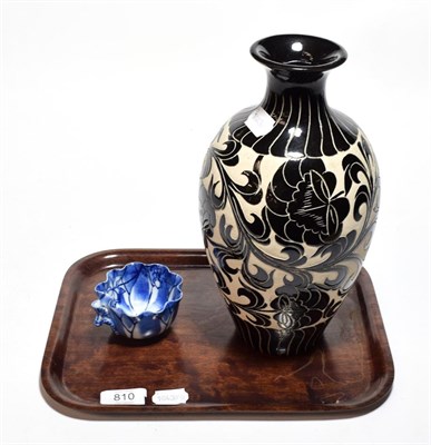 Lot 810 - A Chinese Tz'u Chou style vase and a small Chinese blue and white leaf form cup (2)