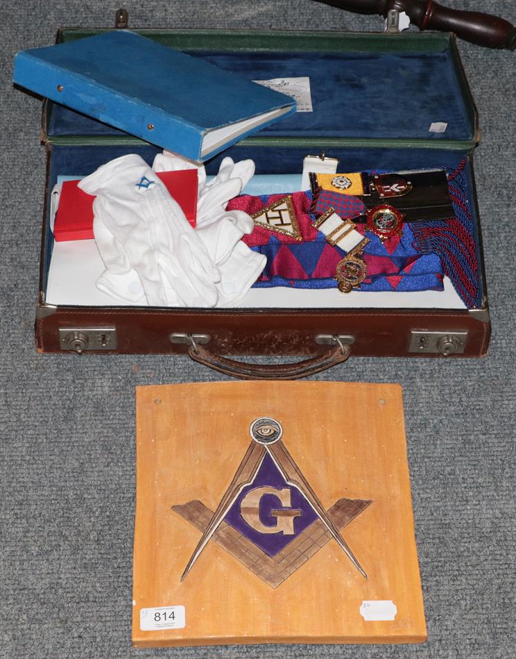 Lot 814 - A leather case, containing Masonic regalia, together with a Masonic tile