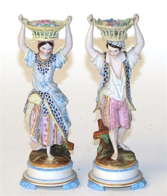 Lot 821 - A pair of Victorian bisque figures of flower sellers