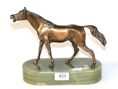 Lot 823 - A bronze horse with green onyx base