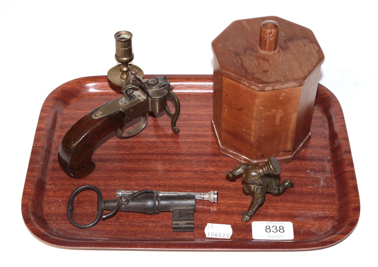 Lot 838 - A tray of miscellaneous items, including a pistol form table lighter, a key (drilled as a...