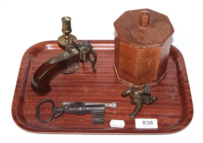 Lot 838 - A tray of miscellaneous items, including a pistol form table lighter, a key (drilled as a...