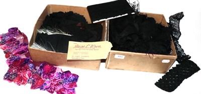 Lot 843 - Assorted mainly black machine worked lace trims and edgings, large length of lace; two evening...