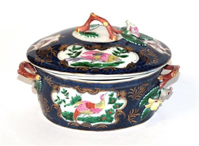 Lot 848 - A Worcester butter tub and cover, of oval form, with twiggy floral handles, decorated with...