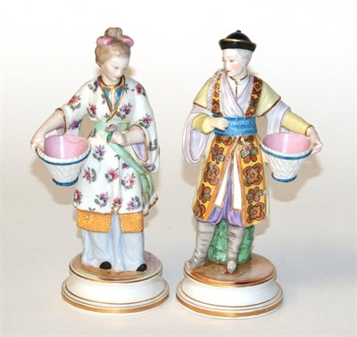 Lot 850 - A pair of 20th century Meissen chinoiserie figures (a.f.)