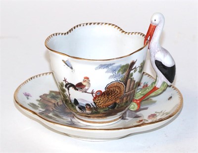 Lot 857 - A 20th century Meissen hand painted tea cup and saucer decorated with chickens and insects and with