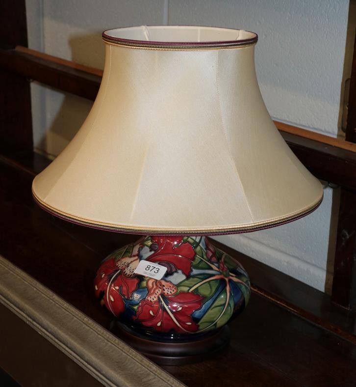 Lot 873 - A modern Moorcroft Simeon pattern lamp with original shade