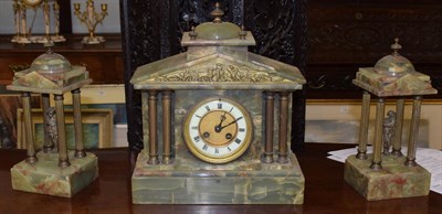 Lot 879 - A green onyx striking mantel clock with garniture, retailed by W Lockwood, 3 Victorian Lane,...