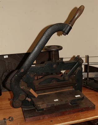 Lot 911 - Late 19th/early 20th century printing shop contents: A table mounted page guillotine together...