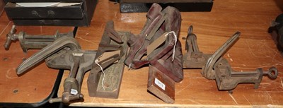 Lot 913 - Late 19th/early 20th century printing shop contents: Four various table clamps and mitres