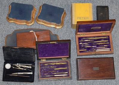 Lot 915 - Late 19th/early 20th century printing shop contents: A small group of cased drawing implements...