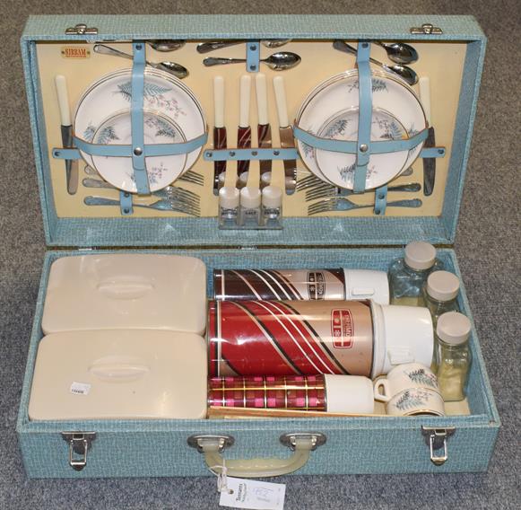 Lot 952 - A cased 1950's-1960's three-person Sirram picnic hamper containing sandwich plates, knives & forks