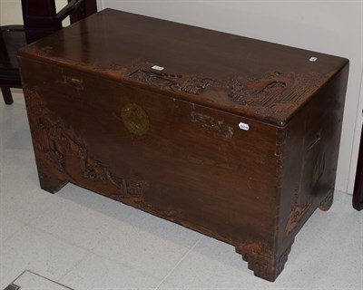 Lot 1103 - An early 20th century carved camphor wood chest, with hinged lid