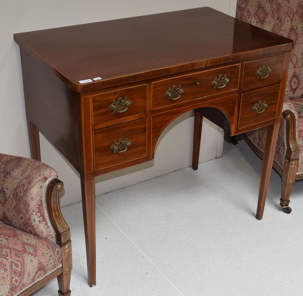 Lot 1106 - An inlaid mahogany dressing/writing table on four tapering square-section legs