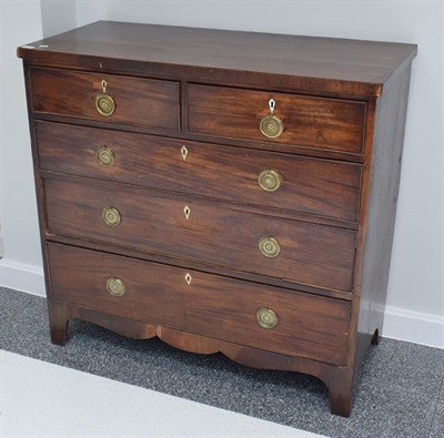 Lot 1109 - A George III mahogany four-height straight front chest of drawers
