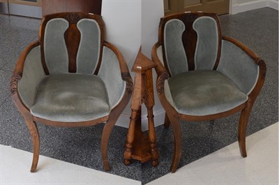 Lot 1112 - A pair of Art Deco walnut tub shaped armchairs