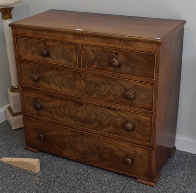 Lot 1114 - A mid-19th century mahogany four-height chest of drawers